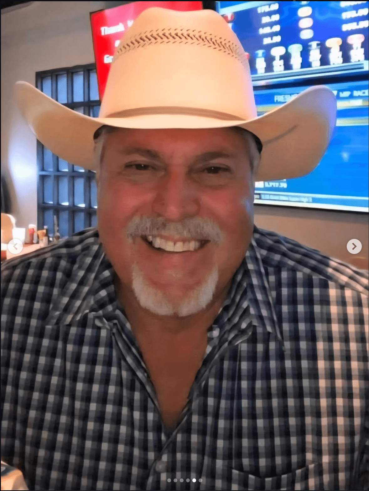 Armen Zennedjian, founder of The Derby Room, smiling beneath a cowboy hat